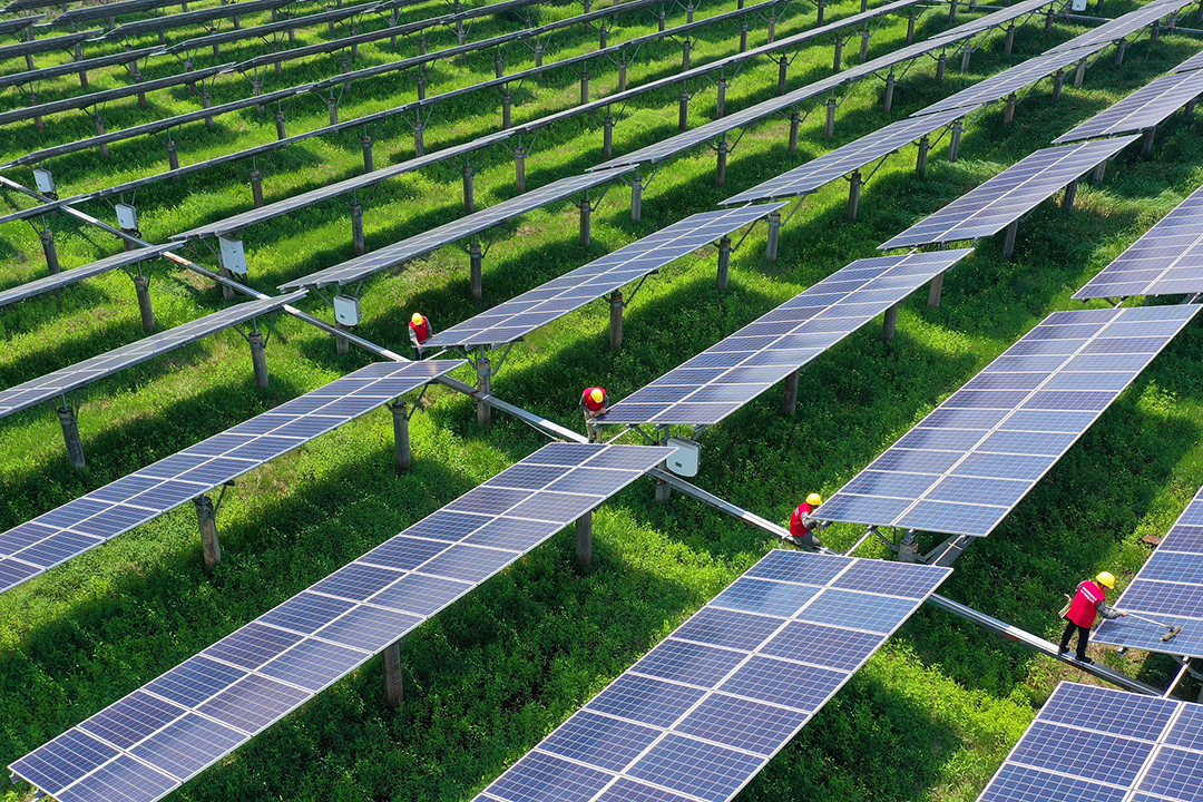 Staff inspect and repair solar panels in a town in Ji'an City, Jiangxi province on April 20, 2022. Photo: VCG